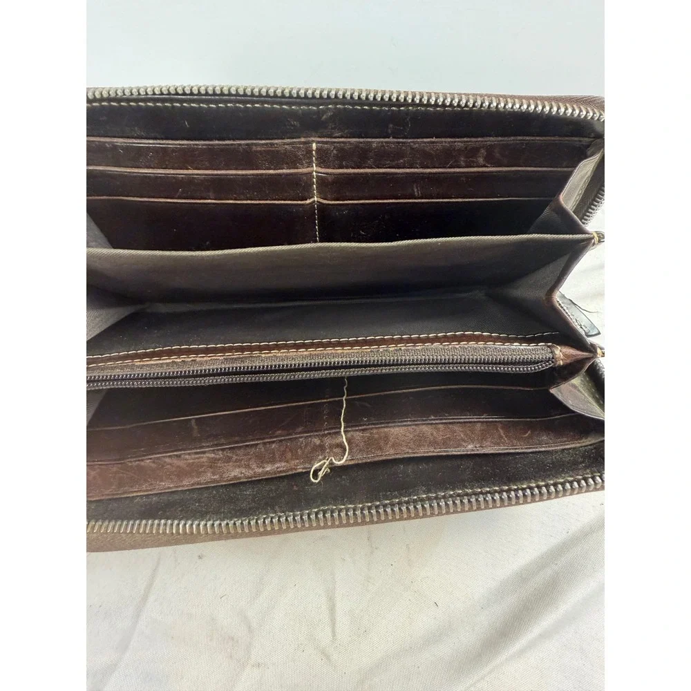 Dooney & Bourke Dark Brown Pebbled Leather Zip Around Continental Wallet Logo